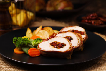 Delicious chicken rolls with dried tomatoes and mozzarella.