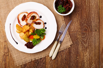 Delicious chicken rolls with dried tomatoes and mozzarella.