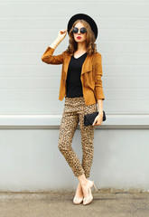 Fashion pretty young woman model wearing a retro elegant hat, su