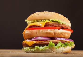 Fresh burger on wooden background