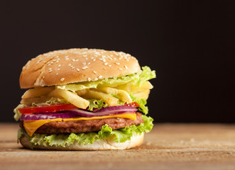 Fresh burger on wooden background