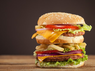 Fresh burger on wooden background