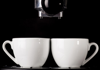 Espresso cups and coffee machine.