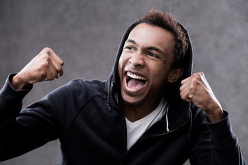 Screaming with joy African American man portrait