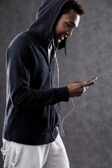 African American man making playlist