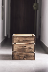 Wooden container box on a dark corridor