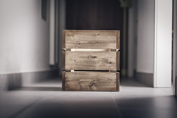 Wooden container box on a dark corridor