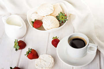 tasty zephyrs on white wooden table. sweet zephyrs and strawberry on wood background.