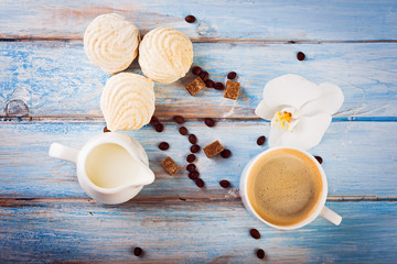  tasty zephyr on blue wooden table, close up. Bakery products on wood background.