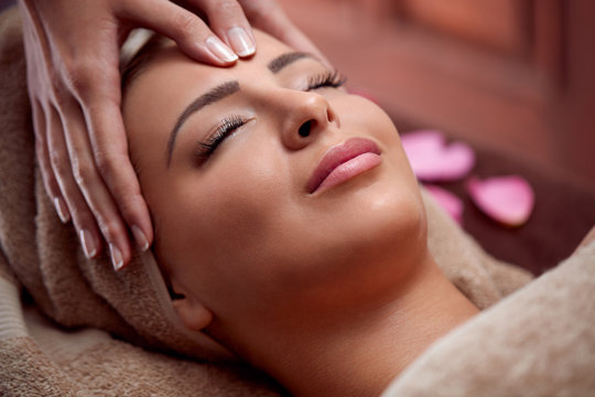 woman enjoy in face massage