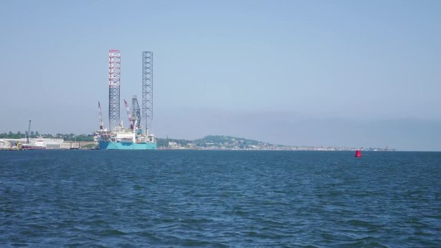 Jack up oil drilling rig in the shipyard for maintenance in Dundee, Scotland, UK. This rig is widely used in UK sector (Time Lapse)
