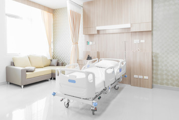Hospital room with beds and comfortable medical equipped  - obrazy, fototapety, plakaty