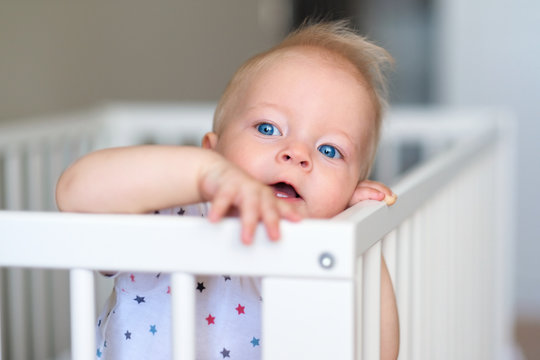 Baby Boy Standing In Crib