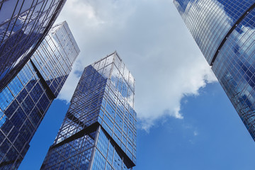 Fototapeta na wymiar Modern scyscrapers on blue sky backdrop