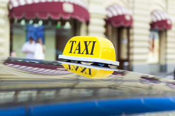 Yellow TAXI sign