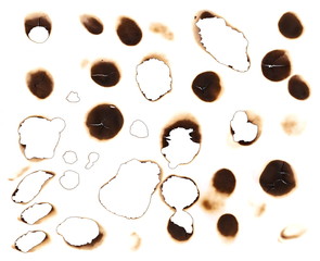 Set of burnt holes of paper, texture and background