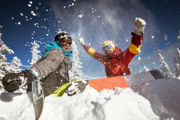 Raamstickers Couple of snowboarders having fun © cppzone