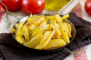 Roasted fried buttery potatoes with thyme
