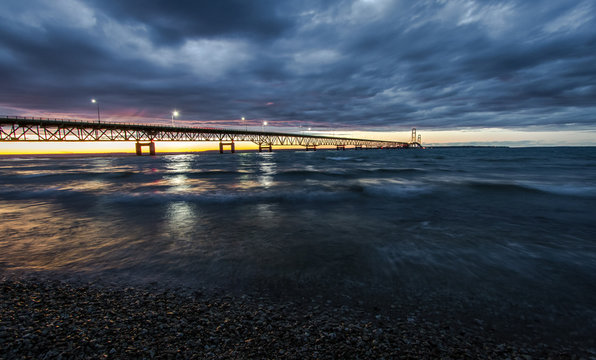 Storm Clouds Over Mackinaw. Storm clouds envelop the sunset over the Mackinaw Bridge in Michigan.