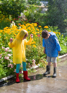 kids in rain at backyard