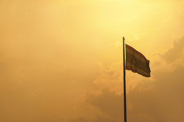 Flagstaff Thailand with gold sky with copy space for message of concpet
