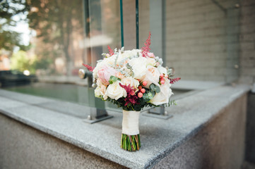 beautiful modern wedding bouquet on a stone slab