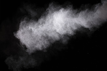 Fototapeta na wymiar Freeze motion of white dust explosions isolated on black background