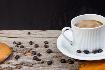Coffee cup and bread on a wooden table. Breakfast