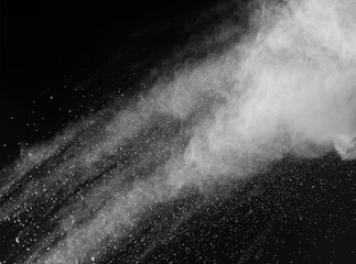 Fototapeta na wymiar Freeze motion of white dust explosions isolated on black 