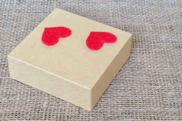 Boxes for gifts and paper heart on the sackcloth