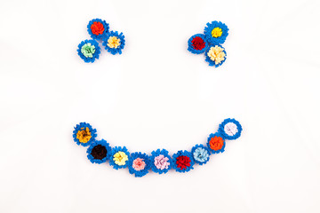 Small, colorful paper flowers made with quilling technique - details