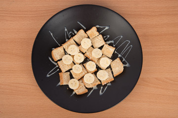 Whole wheat bread with slided banana and  Sweetened condensed milk topping