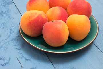 apricots on a blue board