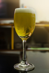Glass of light beer in restaurant