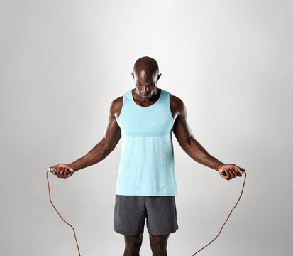 Portrait Of Masculine Man Skipping Rope