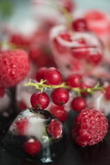 Frozen berries on wooden table
