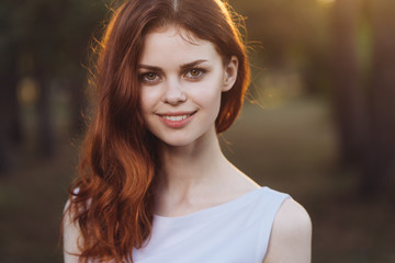 Naklejka premium woman in a white dress park 