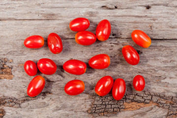 Fresh tomatoes on a wooden table.