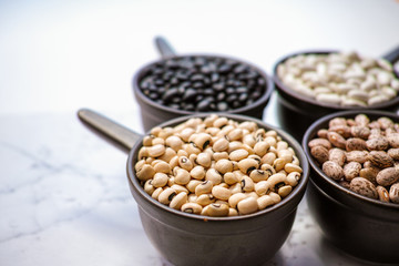 Beans variety/ different types of beans on black wooden backgrou