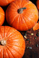 Assortment of autumn pumpkins. .Frame with pumpkins on a wooden