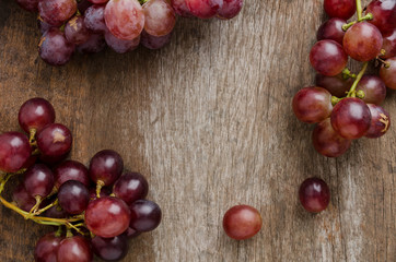 Fresh grape on old wooden table  background