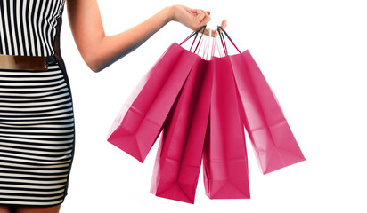 Young woman with bags in shopping mall