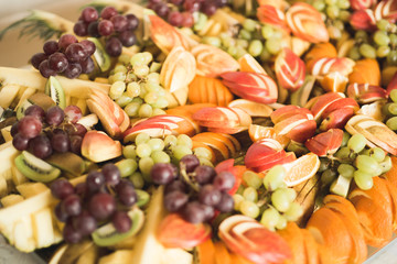 Various sweet sliced fruit on a buffet table