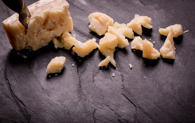Composition of cheese, berries, bottles and glasses of wine on a wooden table