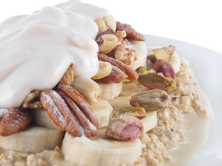 oat flakes in soy milk with banana and nuts and lupin yogurt