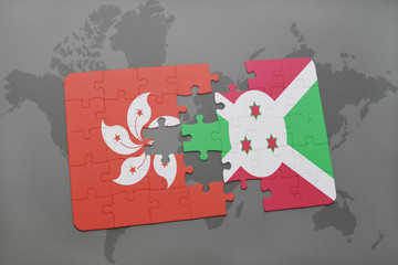 puzzle with the national flag of hong kong and burundi on a world map background.