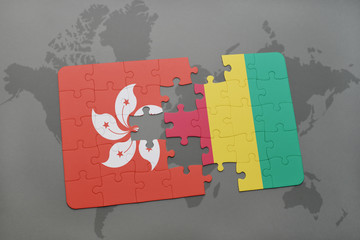 puzzle with the national flag of hong kong and guinea on a world map background.
