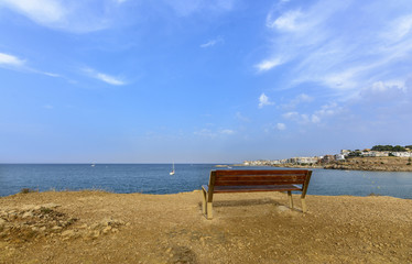 Naklejka na ściany i meble long bench beside the Mediterranean sea