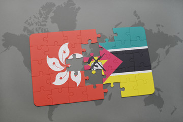 puzzle with the national flag of hong kong and mozambique on a world map background.