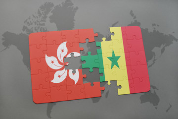 puzzle with the national flag of hong kong and senegal on a world map background.